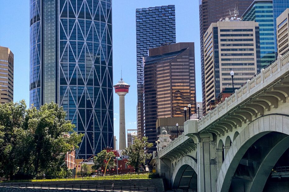 Iconic Calgary Tower standing tall beside the historic Centre Street Bridge, showcasing Calgary's unique skyline and architectural landmarks.