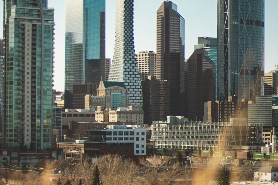 Panoramic view of Calgary downtown skyline at sunset with modern skyscrapers and the Bow River